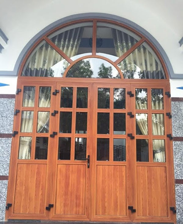 Cửa uốn vòm nhôm kính vân gỗ